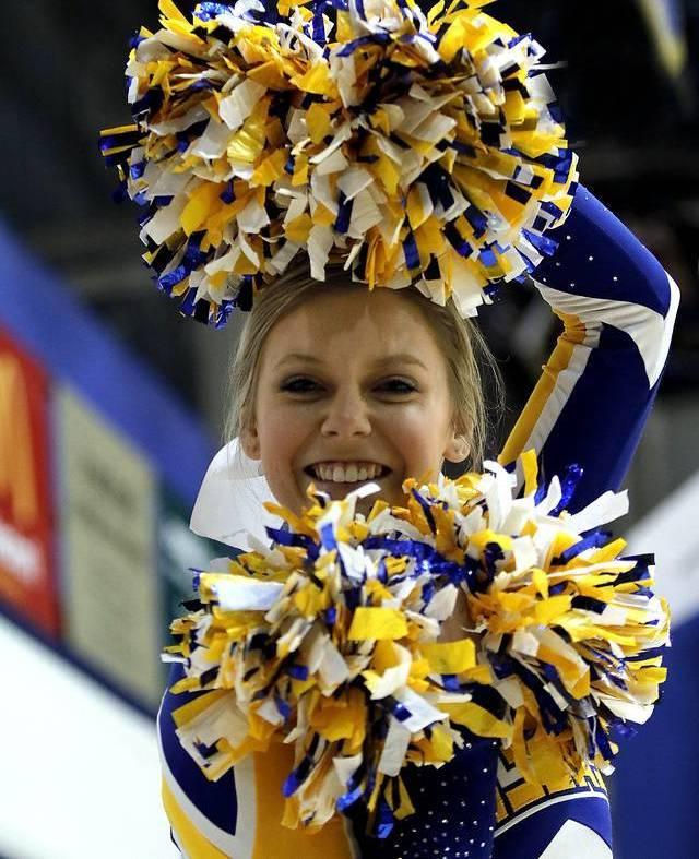 Cheerleader with pom poms